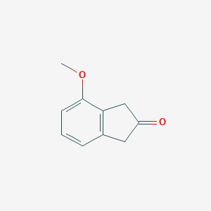 molecular formula C10H10O2 B056366 4-Methoxy-2-indanone CAS No. 124067-30-7