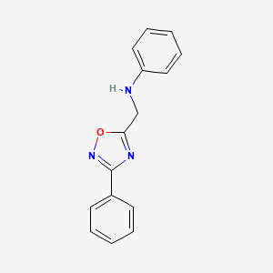 molecular formula C15H13N3O B5643362 N-[(3-phenyl-1,2,4-oxadiazol-5-yl)methyl]aniline 