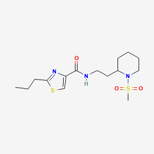 molecular formula C15H25N3O3S2 B5645326 N-{2-[1-(methylsulfonyl)-2-piperidinyl]ethyl}-2-propyl-1,3-thiazole-4-carboxamide 