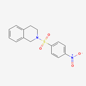molecular formula C15H14N2O4S B5645391 2-[(4-nitrophenyl)sulfonyl]-1,2,3,4-tetrahydroisoquinoline 