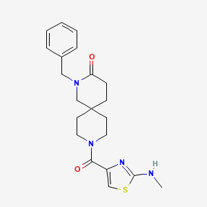 molecular formula C21H26N4O2S B5646914 2-benzyl-9-{[2-(methylamino)-1,3-thiazol-4-yl]carbonyl}-2,9-diazaspiro[5.5]undecan-3-one 