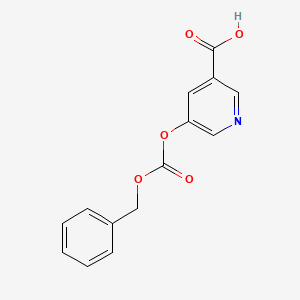 molecular formula C14H11NO5 B5652705 5-{[(benzyloxy)carbonyl]oxy}nicotinic acid 