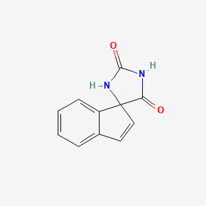 molecular formula C11H8N2O2 B566550 Spiro[imidazolidine-4,1'-indene]-2,5-dione CAS No. 102325-53-1