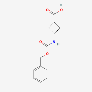 molecular formula C13H15NO4 B566995 trans-3-(Cbz-amino)cyclobutanecarboxylic acid CAS No. 1212380-76-1