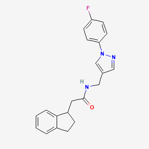 molecular formula C21H20FN3O B5670816 2-(2,3-dihydro-1H-inden-1-yl)-N-{[1-(4-fluorophenyl)-1H-pyrazol-4-yl]methyl}acetamide 