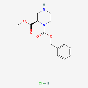 1-O-benzyl 2-O-methyl (2R)-piperazine-1,2-dicarboxylate;hydrochloride