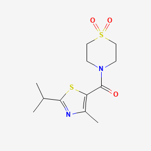 molecular formula C12H18N2O3S2 B5677814 4-[(2-isopropyl-4-methyl-1,3-thiazol-5-yl)carbonyl]thiomorpholine 1,1-dioxide 