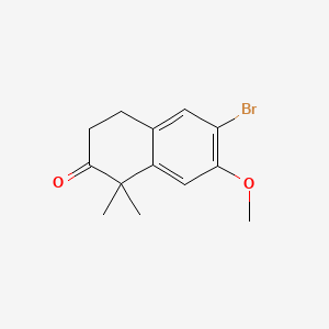 molecular formula C13H15BrO2 B572834 6-bromo-7-methoxy-1,1-dimethyl-3,4-dihydronaphthalen-2(1H)-one CAS No. 1256578-99-0