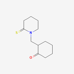 molecular formula C12H19NOS B574666 1-[(2-Oxocyclohexyl)methyl]piperidine-2-thione CAS No. 189940-42-9
