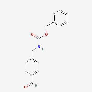 molecular formula C16H15NO3 B575268 Benzyl 4-formylbenzylcarbamate CAS No. 159730-67-3