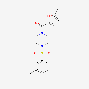 molecular formula C18H22N2O4S B5789771 1-[(3,4-dimethylphenyl)sulfonyl]-4-(5-methyl-2-furoyl)piperazine 