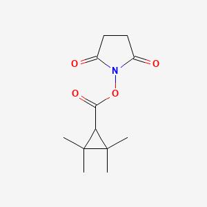 molecular formula C12H17NO4 B5866051 1-{[(2,2,3,3-tetramethylcyclopropyl)carbonyl]oxy}-2,5-pyrrolidinedione 