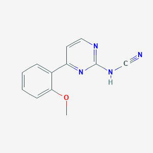 {[4-(2-METHOXYPHENYL)PYRIMIDIN-2-YL]AMINO}FORMONITRILE