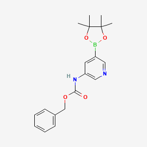 molecular formula C19H23BN2O4 B597947 Benzyl (5-(4,4,5,5-tetramethyl-1,3,2-dioxaborolan-2-yl)pyridin-3-yl)carbamate CAS No. 1218790-11-4