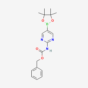 molecular formula C18H22BN3O4 B599195 苄基（5-(4,4,5,5-四甲基-1,3,2-二氧杂硼环-2-基)嘧啶-2-基）氨基甲酸酯 CAS No. 1256359-98-4