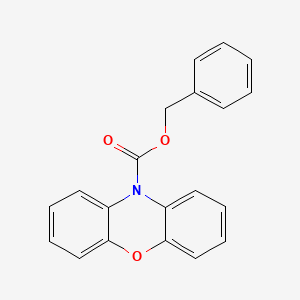 molecular formula C20H15NO3 B610304 benzyl 10H-phenoxazine-10-carboxylate CAS No. 1407632-07-8