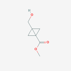 molecular formula C7H10O3 B062876 Methyl 3-(hydroxymethyl)bicyclo[1.1.0]butane-1-carboxylate CAS No. 175881-32-0