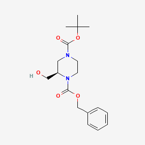 molecular formula C18H26N2O5 B6331349 (R)-2-Hydroxymethyl-piperazine-1,4-dicarboxylic acid 1-benzyl ester 4-tert-butyl ester, 97% CAS No. 1217813-68-7
