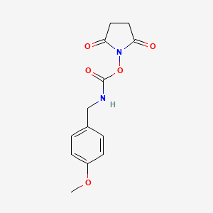 molecular formula C13H14N2O5 B6350947 1-({[(4-Methoxybenzyl)amino]carbonyl}oxy)pyrrolidine-2,5-dione, 90% CAS No. 495384-02-6