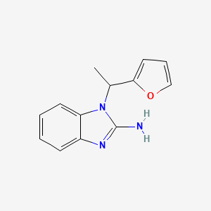 B6352397 1-[1-(Furan-2-yl)ethyl]-2,3-dihydro-1H-1,3-benzodiazol-2-imine CAS No. 1153296-48-0