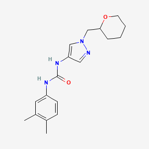molecular formula C18H24N4O2 B6424182 1-(3,4-dimethylphenyl)-3-{1-[(oxan-2-yl)methyl]-1H-pyrazol-4-yl}urea CAS No. 2034374-46-2