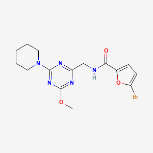 5-bromo-N-{[4-methoxy-6-(piperidin-1-yl)-1,3,5-triazin-2-yl]methyl}furan-2-carboxamide