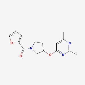 molecular formula C15H17N3O3 B6429971 4-{[1-(furan-2-carbonyl)pyrrolidin-3-yl]oxy}-2,6-dimethylpyrimidine CAS No. 2097913-07-8