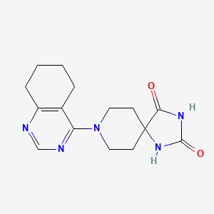 molecular formula C15H19N5O2 B6442789 8-(5,6,7,8-tetrahydroquinazolin-4-yl)-1,3,8-triazaspiro[4.5]decane-2,4-dione CAS No. 2548984-98-9