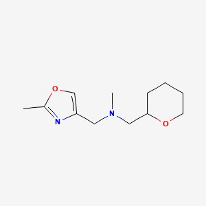 methyl[(2-methyl-1,3-oxazol-4-yl)methyl][(oxan-2-yl)methyl]amine