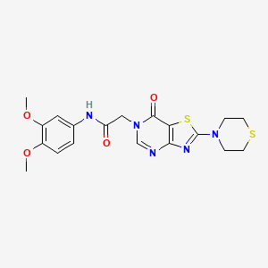 N-(3,4-dimethoxyphenyl)-2-[7-oxo-2-(thiomorpholin-4-yl)-6H,7H-[1,3]thiazolo[4,5-d]pyrimidin-6-yl]acetamide
