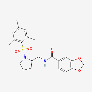 N-{[1-(2,4,6-trimethylbenzenesulfonyl)pyrrolidin-2-yl]methyl}-2H-1,3-benzodioxole-5-carboxamide