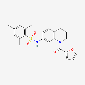 N-[1-(furan-2-carbonyl)-1,2,3,4-tetrahydroquinolin-7-yl]-2,4,6-trimethylbenzene-1-sulfonamide