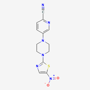 molecular formula C13H12N6O2S B6627004 5-[4-(5-Nitro-1,3-thiazol-2-yl)piperazin-1-yl]pyridine-2-carbonitrile 