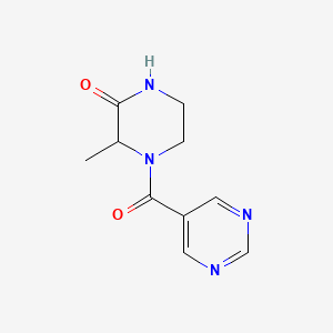molecular formula C10H12N4O2 B6631874 3-Methyl-4-(pyrimidine-5-carbonyl)piperazin-2-one 