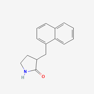 molecular formula C15H15NO B6632048 3-[(Naphthalen-1-yl)methyl]pyrrolidin-2-one 