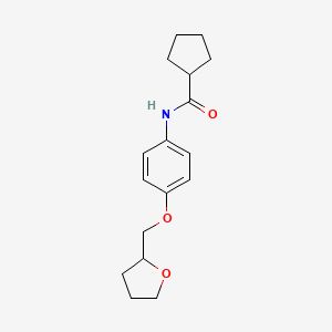 molecular formula C17H23NO3 B6632999 N-[4-(oxolan-2-ylmethoxy)phenyl]cyclopentanecarboxamide 