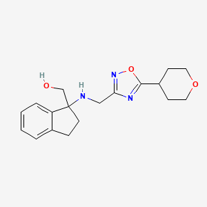 molecular formula C18H23N3O3 B6637393 [1-[[5-(Oxan-4-yl)-1,2,4-oxadiazol-3-yl]methylamino]-2,3-dihydroinden-1-yl]methanol 
