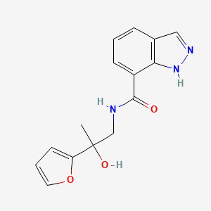 molecular formula C15H15N3O3 B6640410 N-[2-(furan-2-yl)-2-hydroxypropyl]-1H-indazole-7-carboxamide 