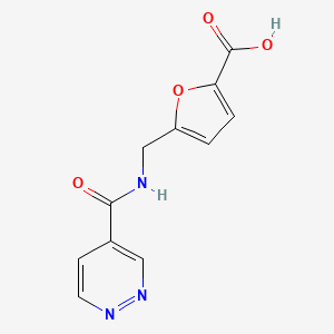 molecular formula C11H9N3O4 B6644037 5-[(Pyridazine-4-carbonylamino)methyl]furan-2-carboxylic acid 