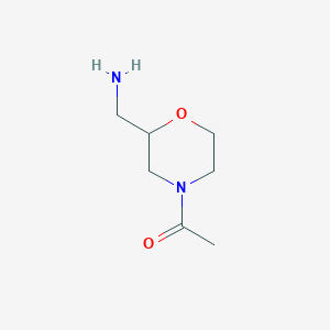 molecular formula C7H14N2O2 B066920 1-(2-(Aminomethyl)morpholino)ethanone CAS No. 182067-97-6