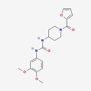 molecular formula C19H23N3O5 B6749257 1-(3,4-Dimethoxyphenyl)-3-[1-(furan-2-carbonyl)piperidin-4-yl]urea 