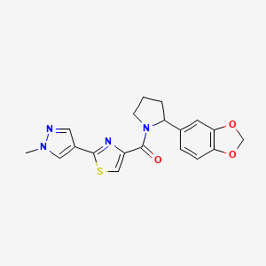 molecular formula C19H18N4O3S B6751880 [2-(1,3-Benzodioxol-5-yl)pyrrolidin-1-yl]-[2-(1-methylpyrazol-4-yl)-1,3-thiazol-4-yl]methanone 