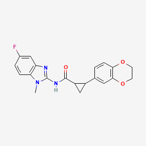 molecular formula C20H18FN3O3 B6754250 2-(2,3-dihydro-1,4-benzodioxin-6-yl)-N-(5-fluoro-1-methylbenzimidazol-2-yl)cyclopropane-1-carboxamide 