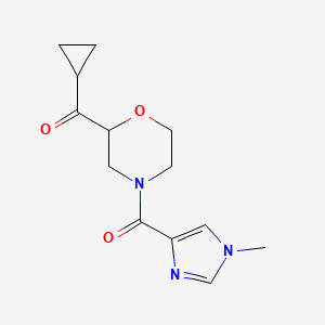 molecular formula C13H17N3O3 B6776600 Cyclopropyl-[4-(1-methylimidazole-4-carbonyl)morpholin-2-yl]methanone 