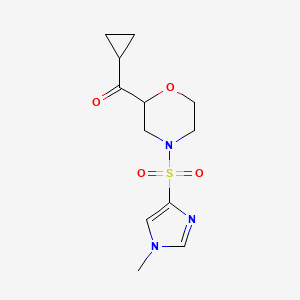 molecular formula C12H17N3O4S B6786796 Cyclopropyl-[4-(1-methylimidazol-4-yl)sulfonylmorpholin-2-yl]methanone 