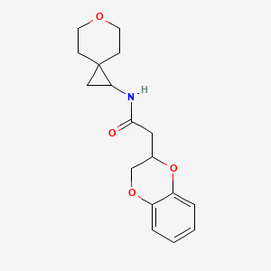 2-(2,3-dihydro-1,4-benzodioxin-3-yl)-N-(6-oxaspiro[2.5]octan-2-yl)acetamide