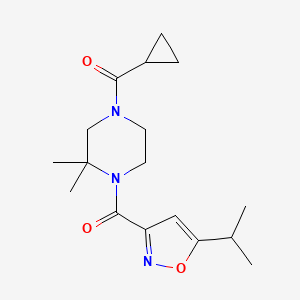 molecular formula C17H25N3O3 B6964937 Cyclopropyl-[3,3-dimethyl-4-(5-propan-2-yl-1,2-oxazole-3-carbonyl)piperazin-1-yl]methanone 