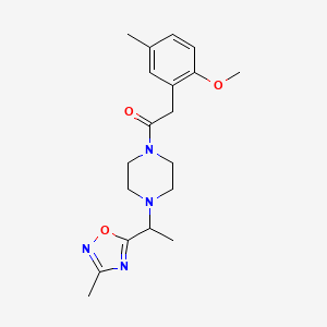 2-(2-Methoxy-5-methylphenyl)-1-[4-[1-(3-methyl-1,2,4-oxadiazol-5-yl)ethyl]piperazin-1-yl]ethanone