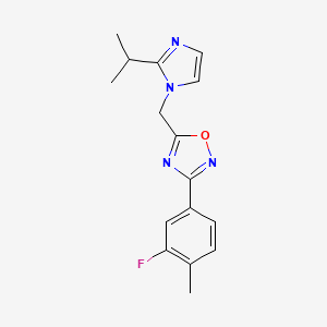 3-(3-Fluoro-4-methylphenyl)-5-[(2-propan-2-ylimidazol-1-yl)methyl]-1,2,4-oxadiazole