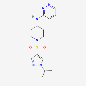 molecular formula C15H22N6O2S B6969291 N-[1-(1-propan-2-ylpyrazol-4-yl)sulfonylpiperidin-4-yl]pyridazin-3-amine 